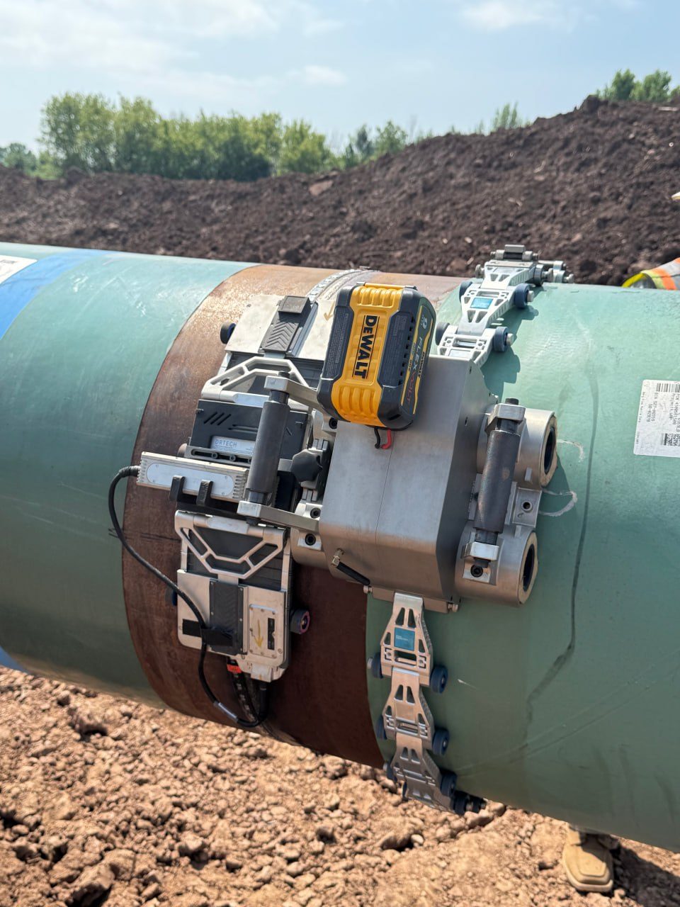 EdgeFlex radiographic (X-ray) crawler clamped on a coated pipeline weld in the field
