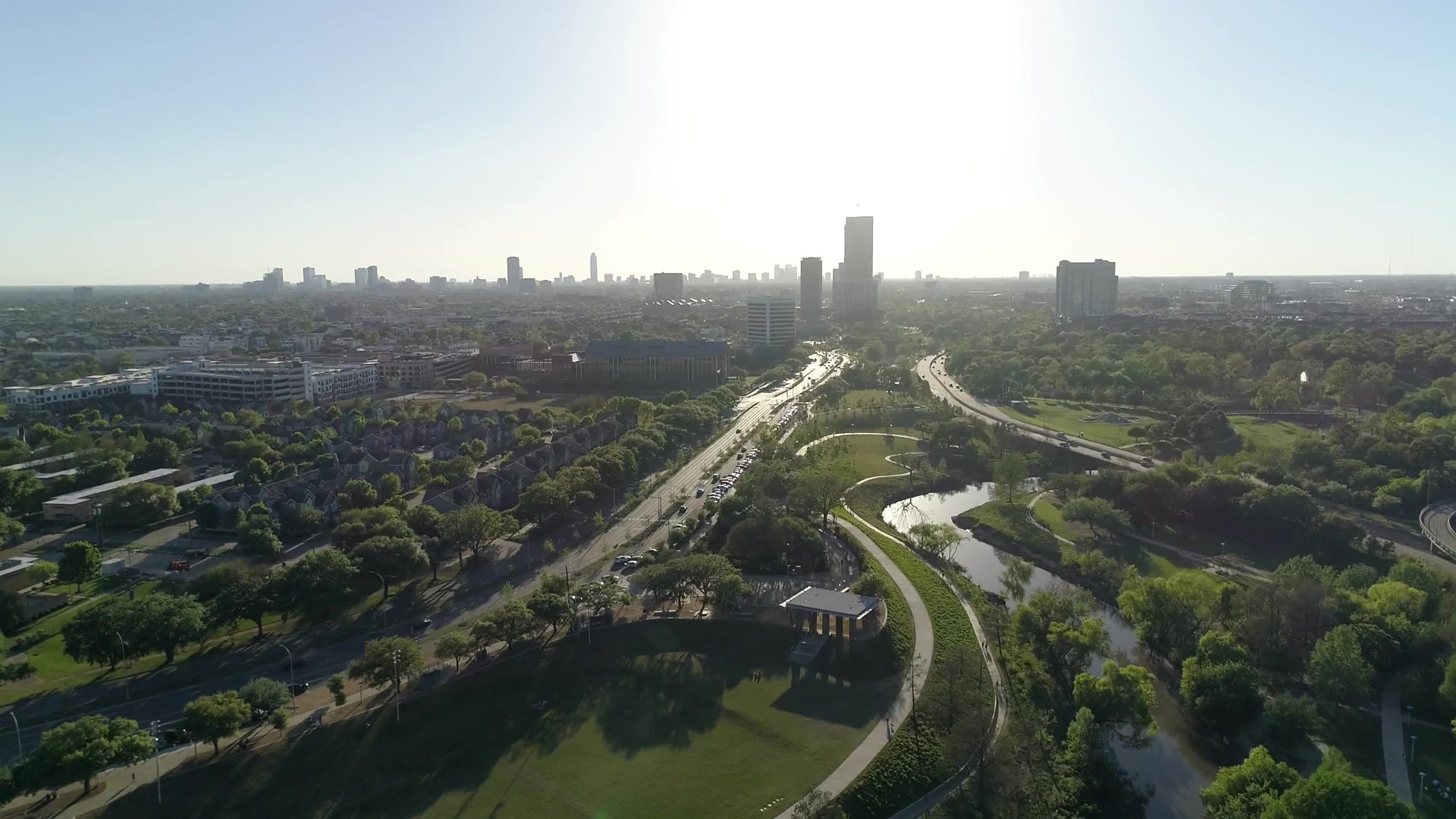 Aerial view of Houston's skyline over Buffalo Bayou Park, with the river, jogging paths and downtown towers