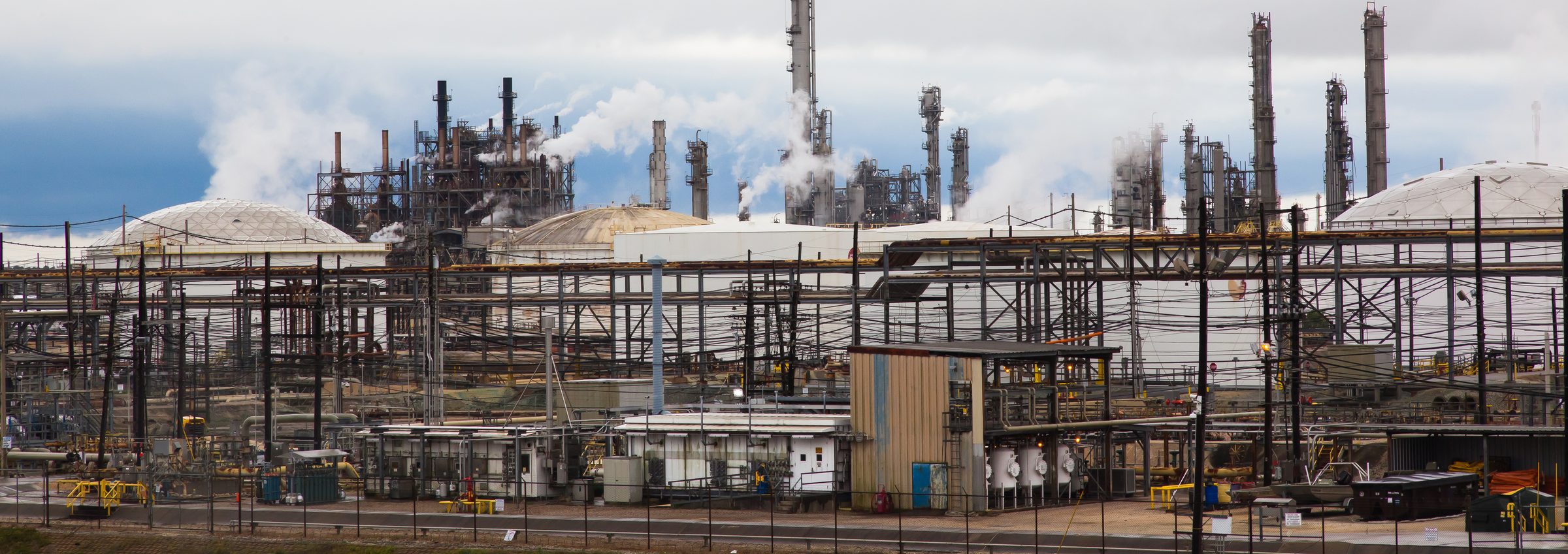 Refinery process units, storage spheres and stacks at a petrochemical plant