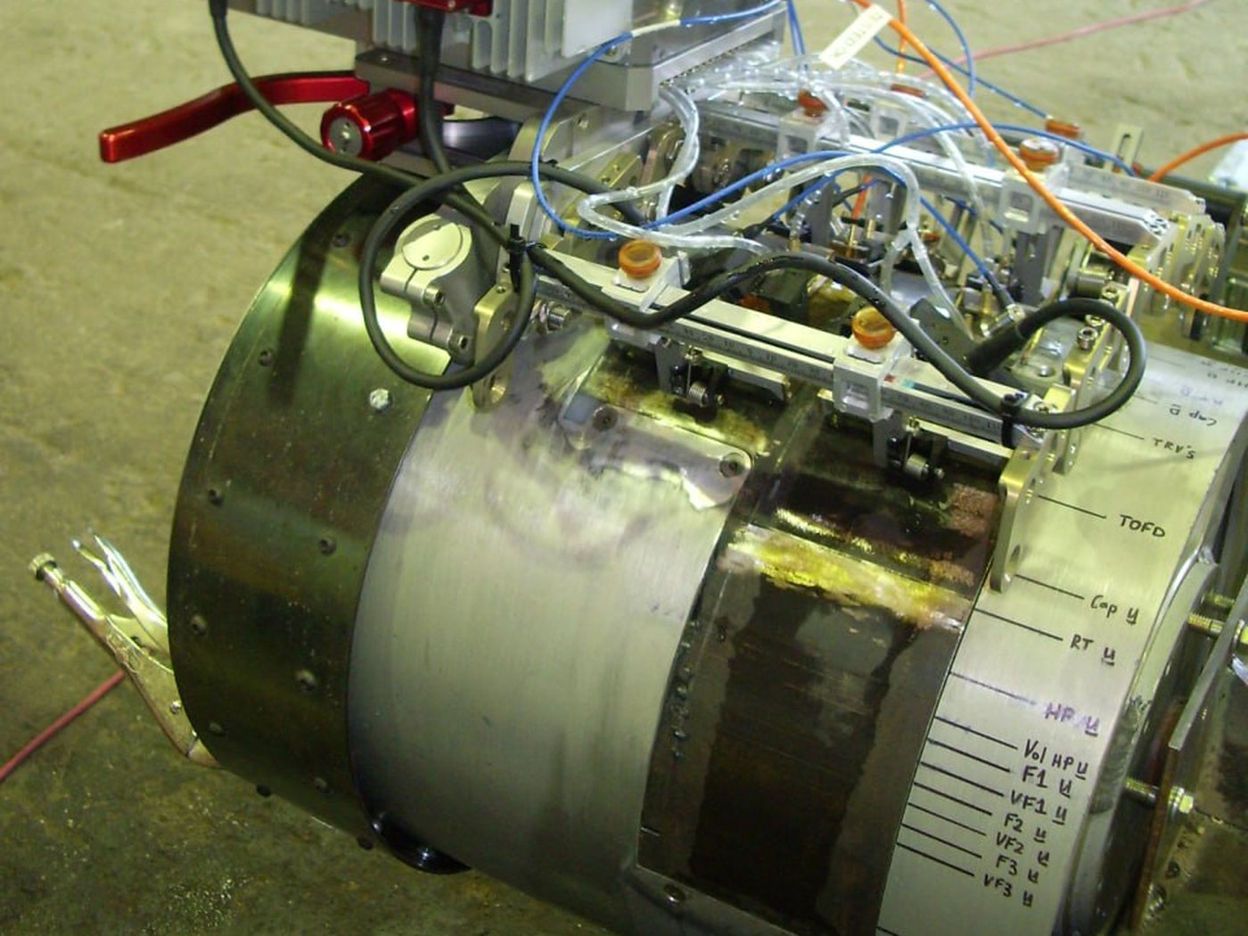 UT Quality automated ultrasonic (AUT) scanner ring with its zonal inspection channels labeled — TOFD, cap, fill and volumetric zones